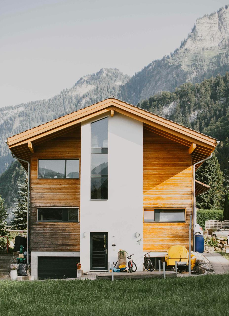 Contemporary house with a simple form and controlled window openings